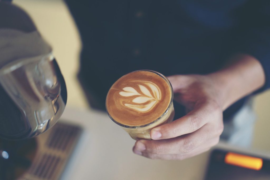 barista-is-pouring-latte-art-e1651646689290.jpg